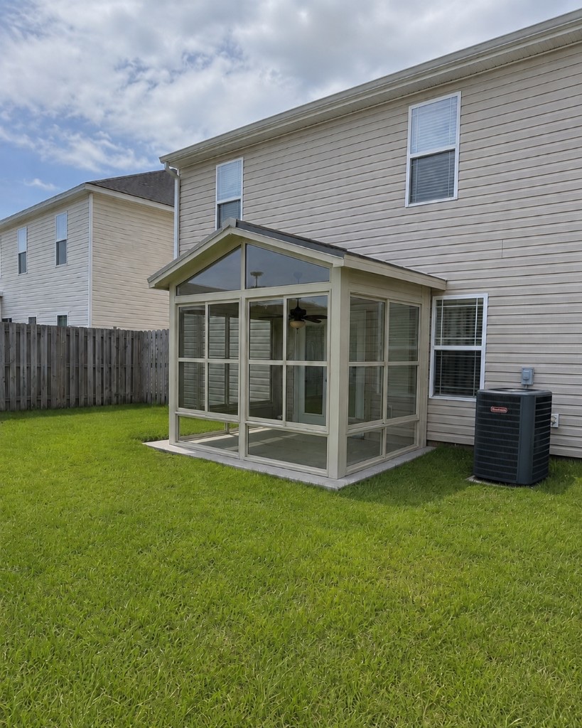 Photorealistic rendering of a Sunspace sunroom on a customer's actual home